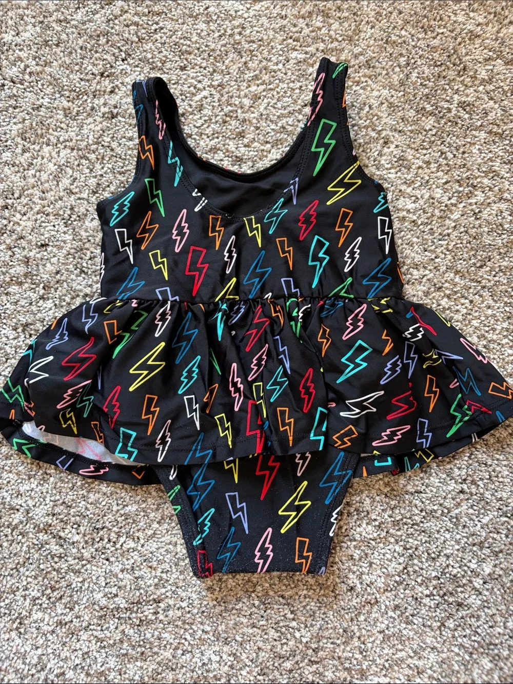 Posh Peanut Black Lightning Bolt Peplum Swimsuit with Multicolor Bolts